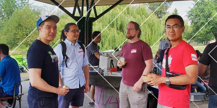 Ping Identity team members gathered outdoors under a park pavilion for an Employee Resource Group event