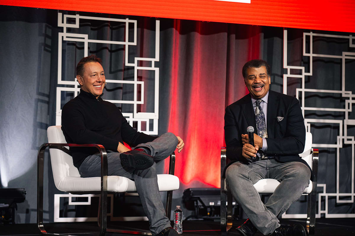 Andre Durand, Ping Identity CEO, and keynote speaker Neil deGrasse Tyson on Ping YOUniverse 2023 stage, Dallas, TX