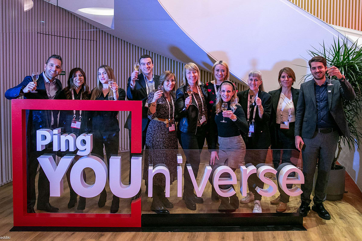 Ping Identity staff raising a glass at Ping YOUniverse 2023, Paris, France