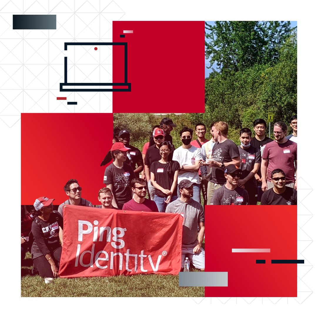 PingIdentity employees of diverse backgrounds gathered outside, smiling and holding up a red PingIdentity banner.