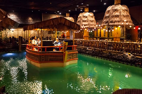 Live band playing music in a tiki hut on the water at the Tonga Room & Hurricane Bar in San Francisco, California.