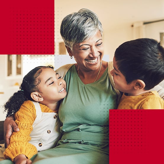 Grandmother laughing with grandchildren