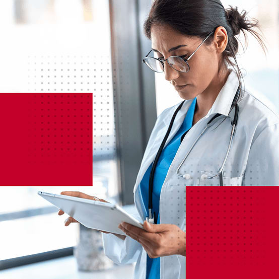 Healthcare worker looking down at clipboard