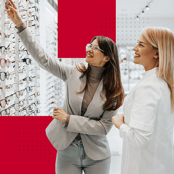 Two women looking at prescription glaesses