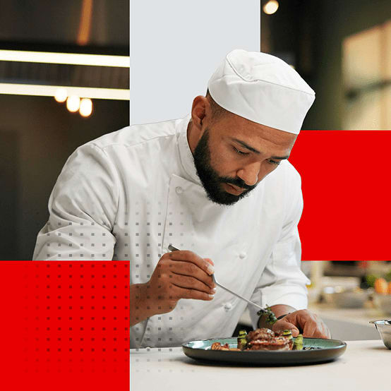 Chef adding final touches to a dish