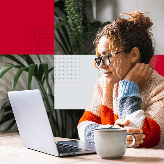 Woman sitting looking at laptop