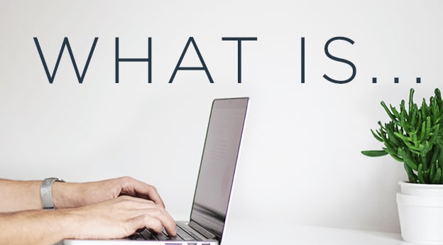 Image of hands typing on a laptop with the words 'WHAT IS' above